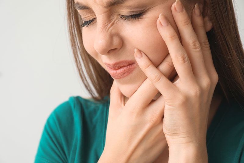 a dental patient suffering from failing dental implants in wayne, nj.